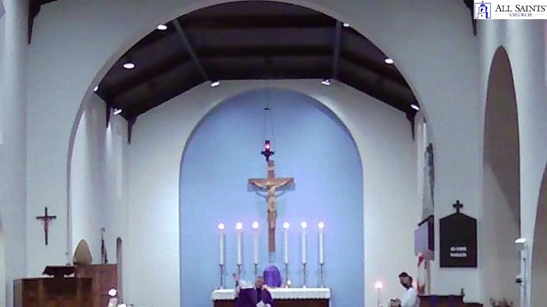 Father Carlos celebrating Mass